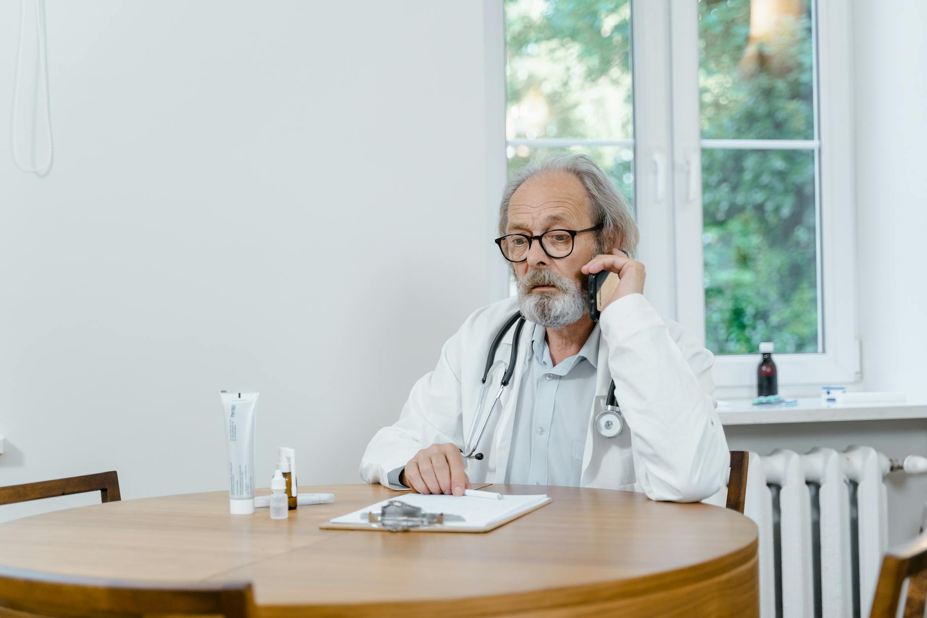 Parent holding a referral slip in a warmly lit orthodontist waiting room, looking uncertain